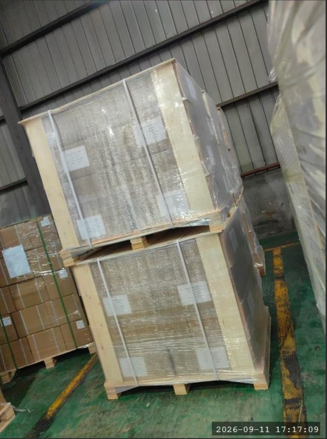 Crated machinery loaded into a shipping container