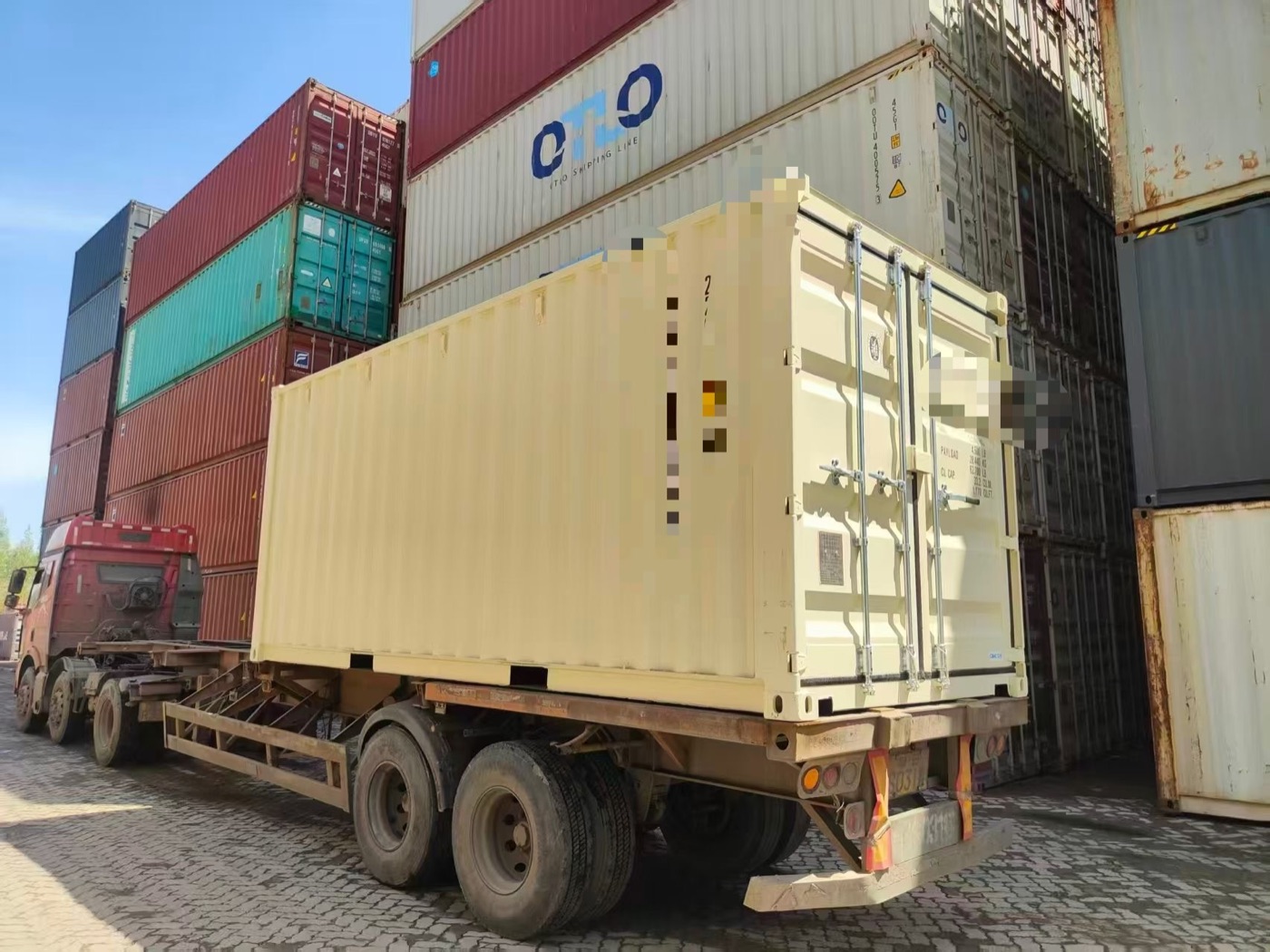 Truck collecting a container at a container depot