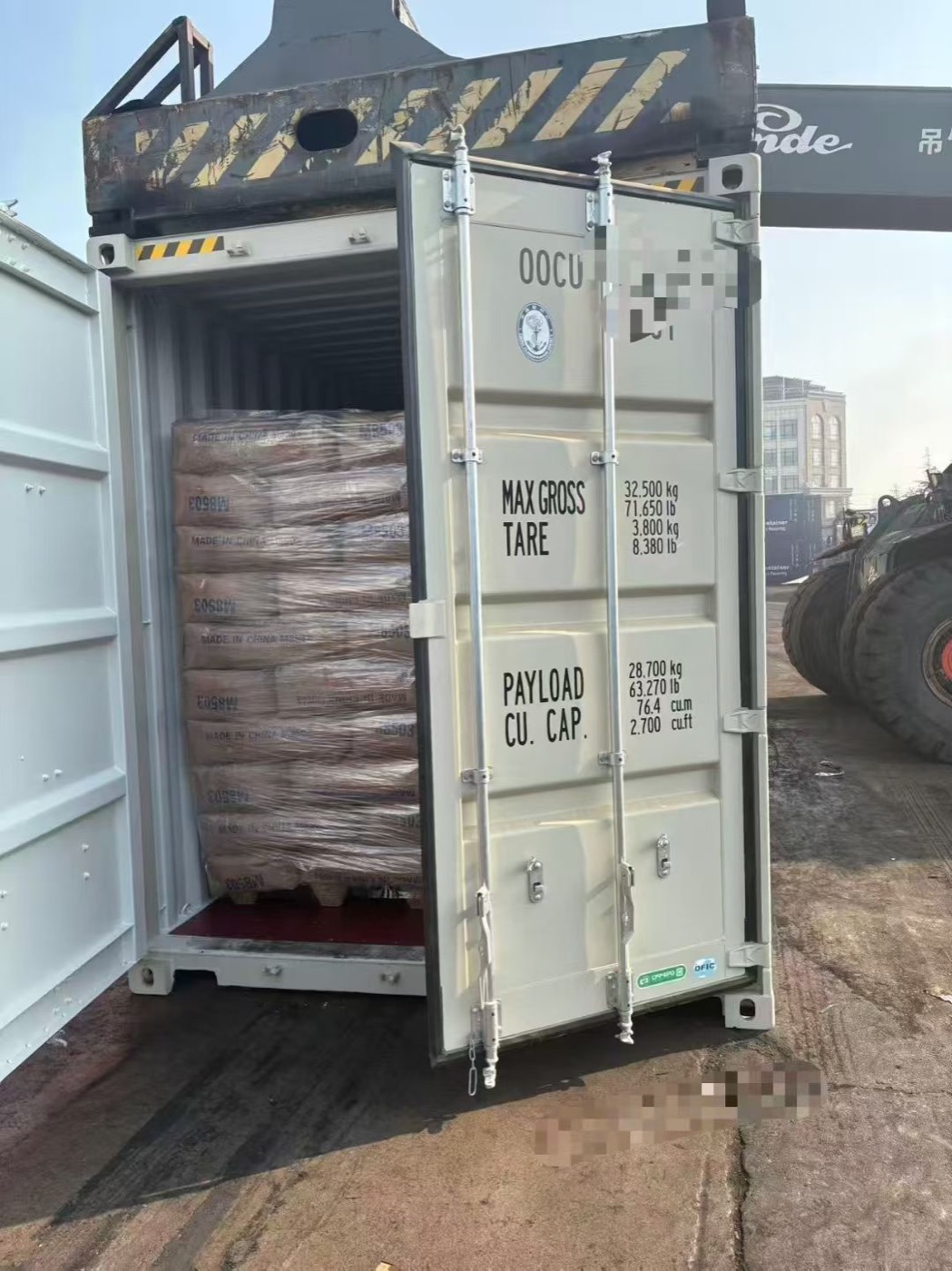 Crated and shrink-wrapped cargo on pallets, prepared for export